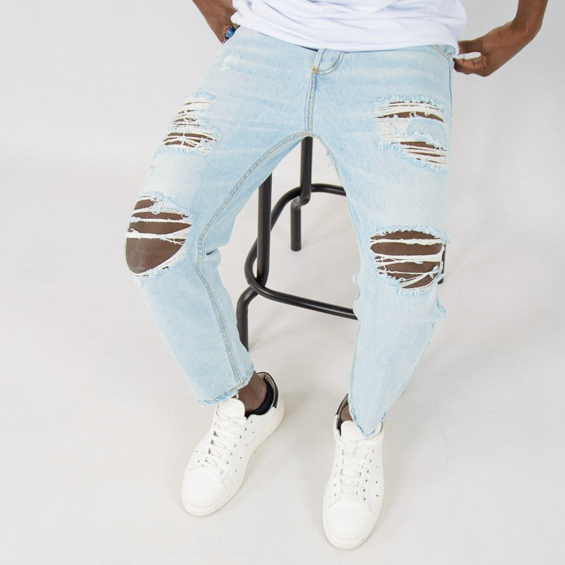 jeans uomo denim rotture chiaro